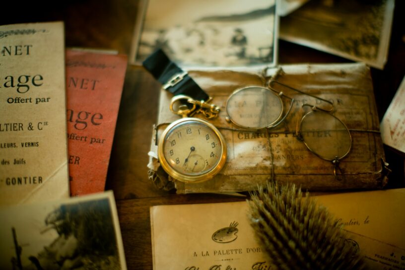 Old photographs, letters, and keepsakes representing forgotten stories and pieces of history rediscovered