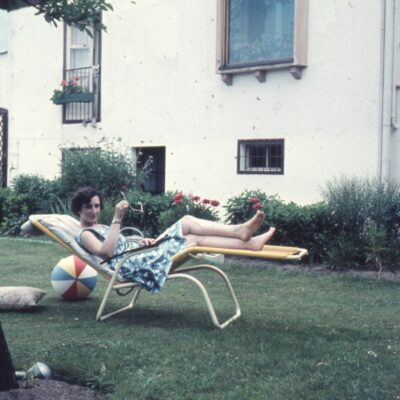 Vintage photograph of people outside a historic home, representing evidence discovered after a paranormal investigation