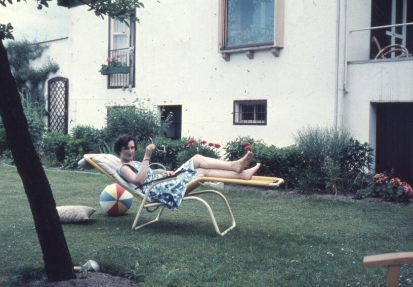 Vintage photograph of people outside a historic home, representing evidence discovered after a paranormal investigation